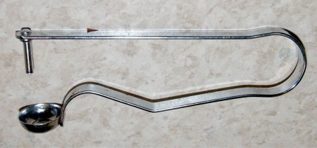 Вытащить косточки из каждой ягоды, это можно сделать, например, с помощью зубочистки. А я в последнее время для удаления косточек из вишни использую вот такое приспособление, как на фото.